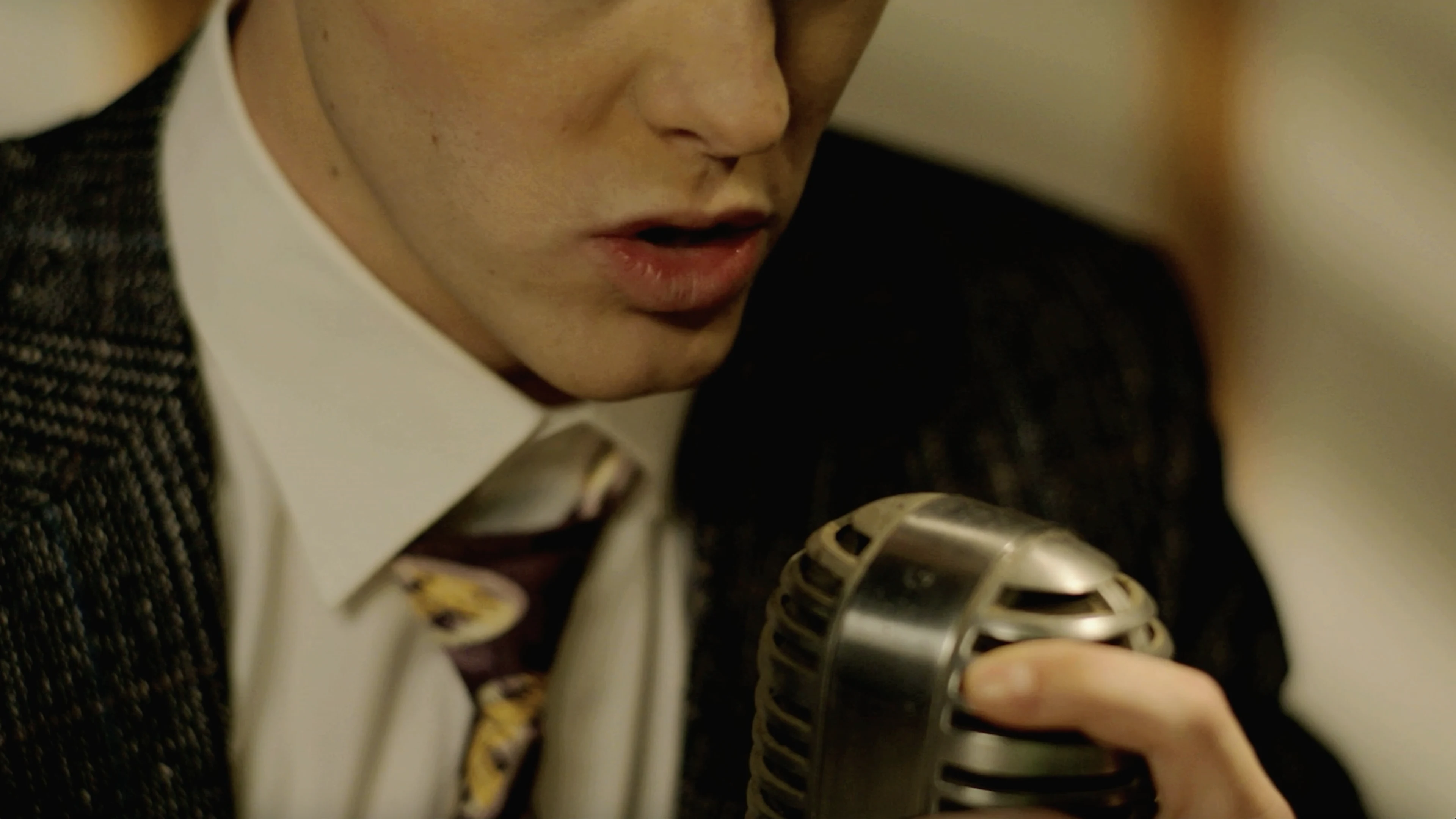 The Man Behind the Microphone