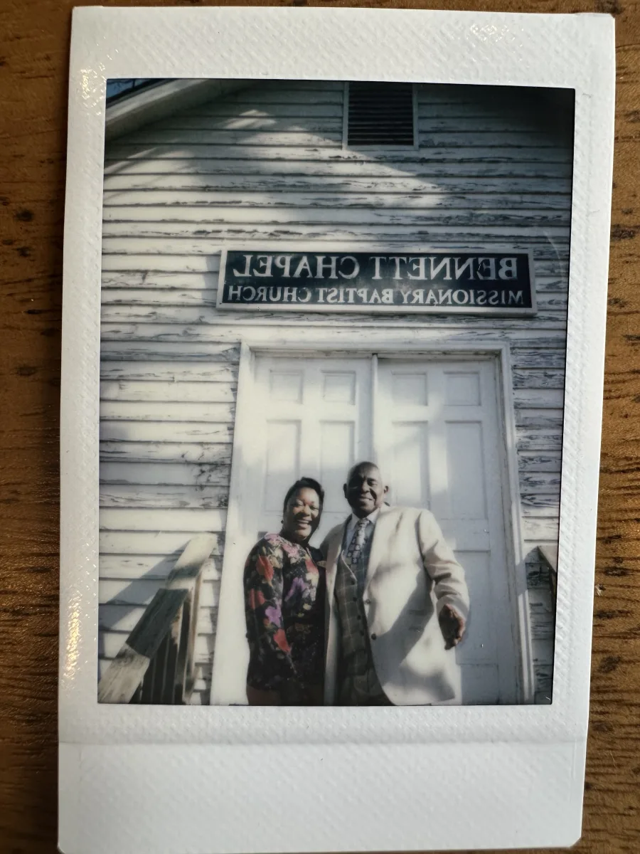 Donna and Reverend Martin in front of Bennett Chapel